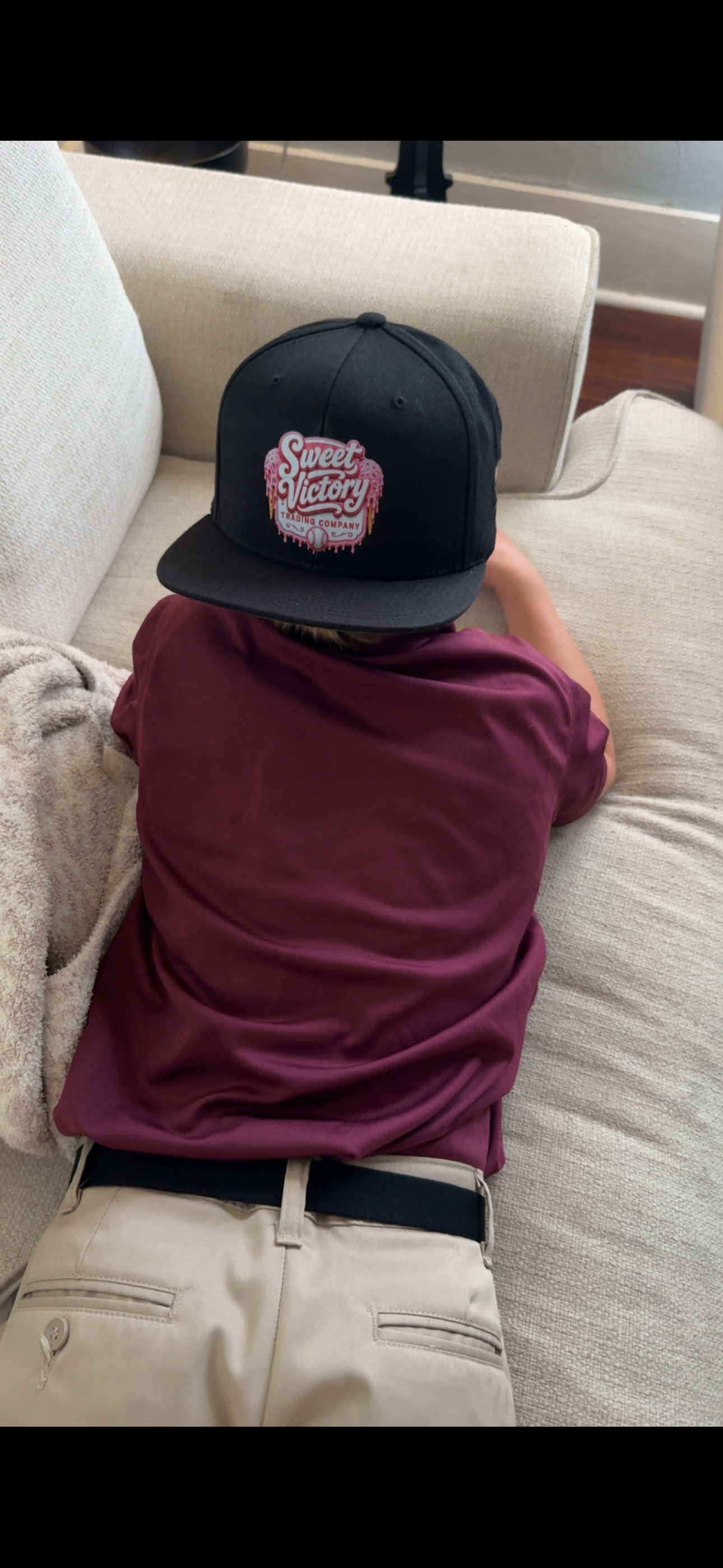 Sweet Victory Trading Co branded cap lifestyle shot